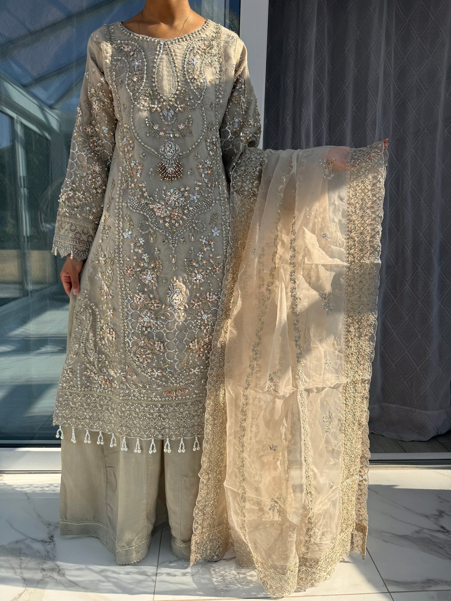 ANIQA BEIGE - Embroidered organza kameez with handwork and Kali Sharara